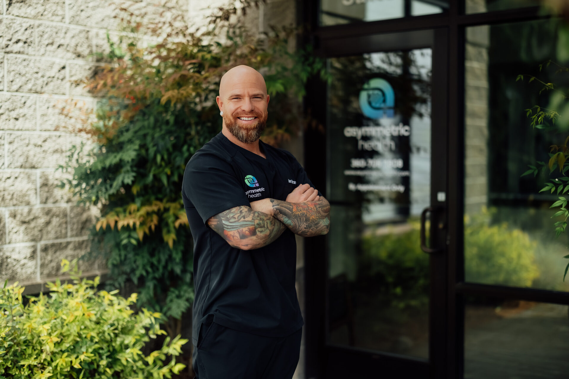 Ian Strand, DO, outside the Asymmetric Health clinic in Lacey, Washington